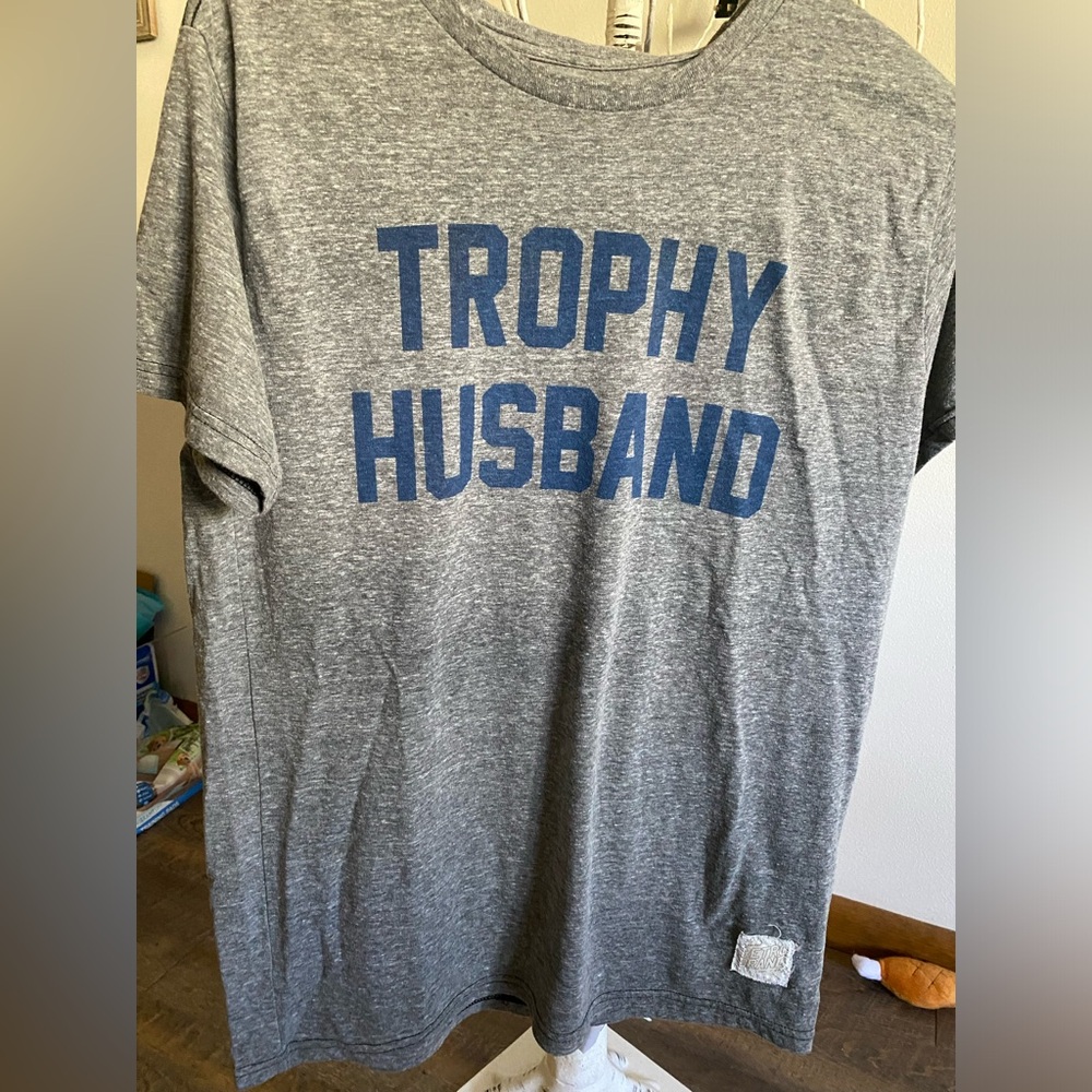 Bnwt trophy husband tshirt size medium can possibly fit a large